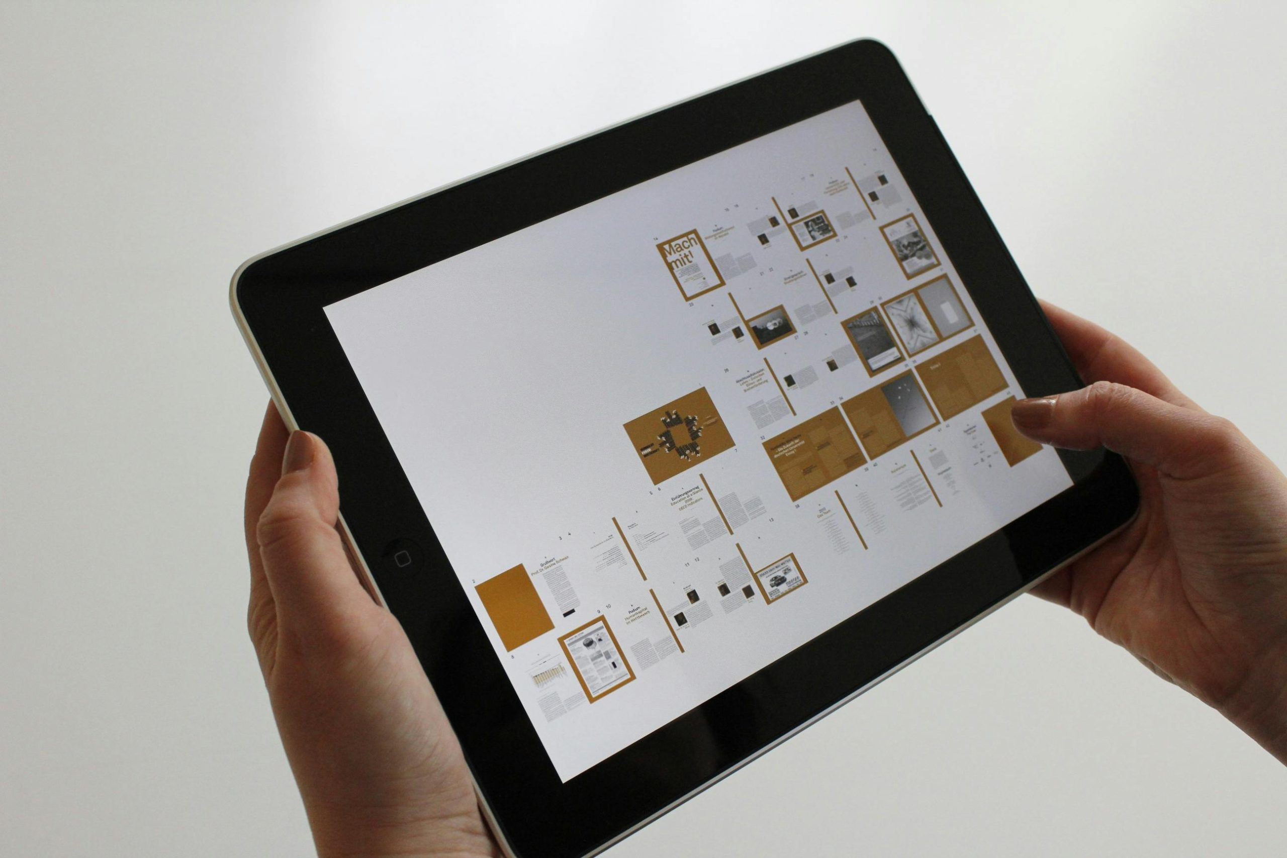 Tablet displaying digital content design, showcasing Hope Media House's innovative projects.